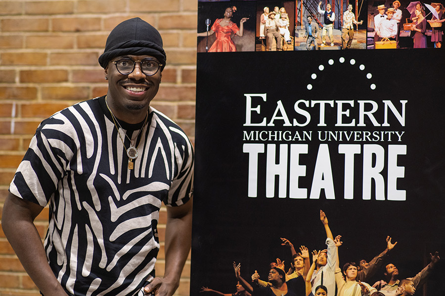 Jawan Jackson in front of Eastern Theatre sign